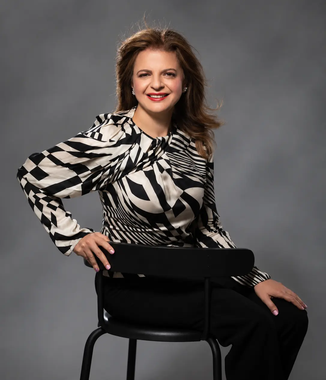 Sima Azadegan seated for a studio portrait